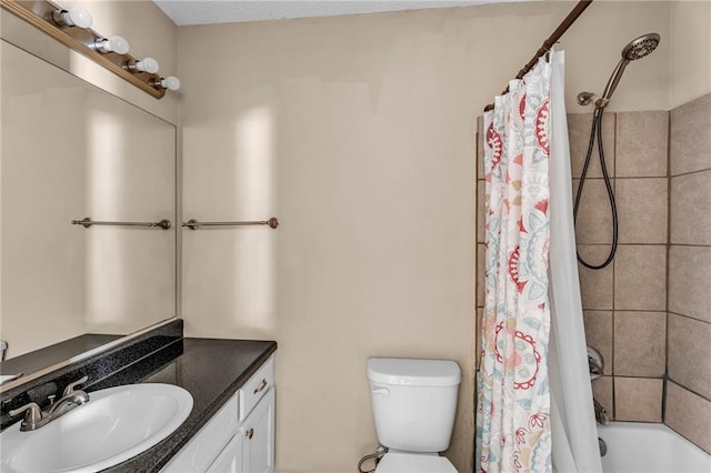 full bathroom with vanity, shower / bath combo with shower curtain, and toilet