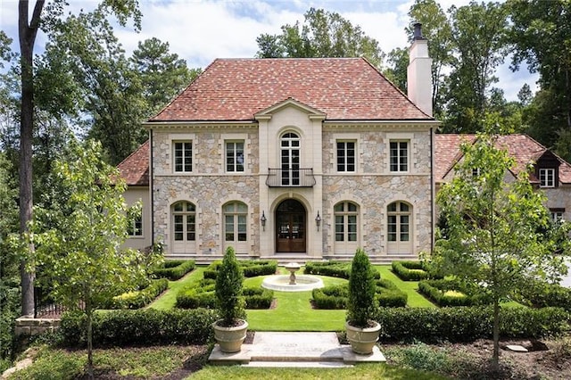 view of front of home featuring a chimney