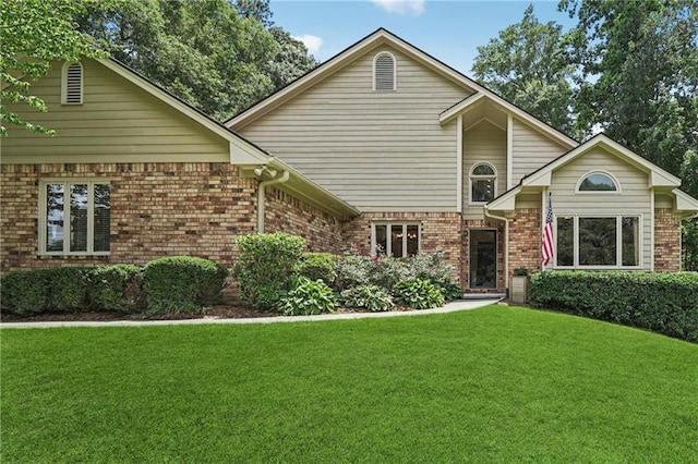 2011 Sturbridge Ln, Buford, GA 30519 - view of front of property with a front yard and brick siding