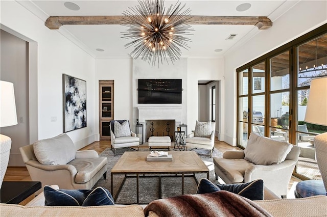 living room featuring a notable chandelier, beam ceiling, wood-type flooring, and ornamental molding