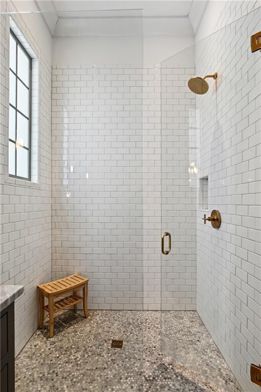 bathroom with vanity and a shower with shower door