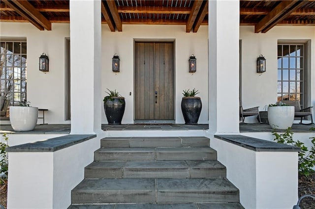 entrance to property with covered porch