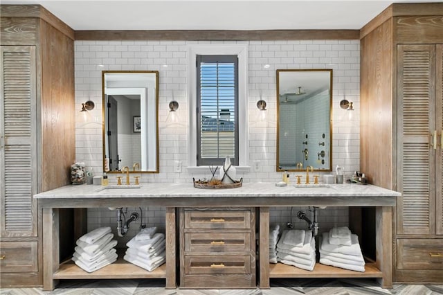 bathroom with vanity and tile walls