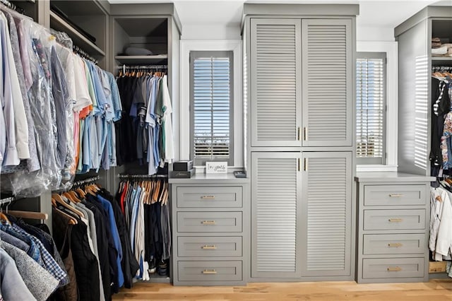 walk in closet featuring light hardwood / wood-style flooring