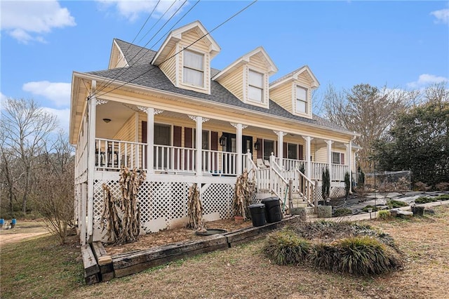 cape cod house featuring covered porch