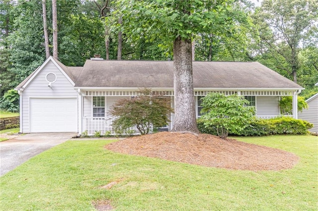 4307 Windward Ln, Norcross, GA 30093 - single story home with asphalt driveway, a front lawn, a garage, view of scattered trees, and covered porch
