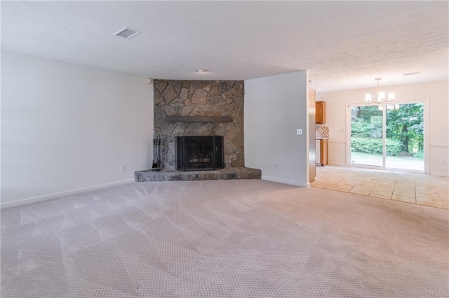 4307 Windward Ln, Norcross, GA 30093 - unfurnished living room with a fireplace, light carpet, a chandelier, and a textured ceiling
