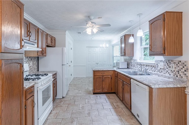 4307 Windward Ln, Norcross, GA 30093 - kitchen with white appliances, under cabinet range hood, a ceiling fan, backsplash, and light countertops