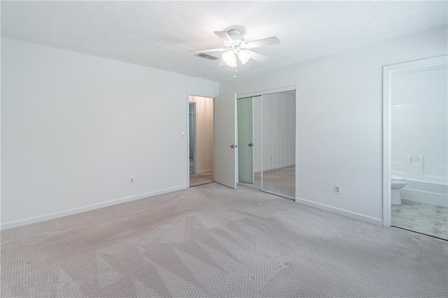 4307 Windward Ln, Norcross, GA 30093 - unfurnished bedroom with light colored carpet, a closet, connected bathroom, and ceiling fan