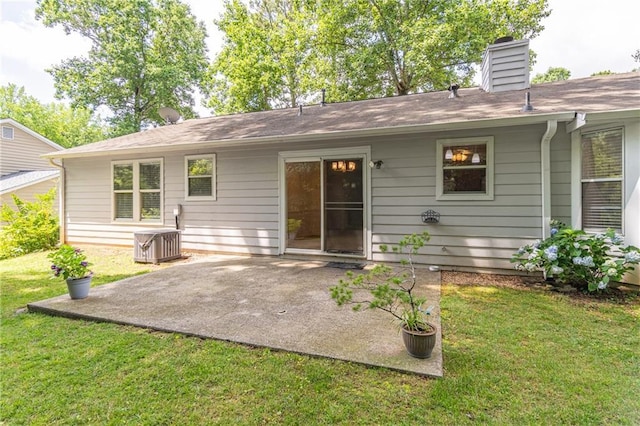 4307 Windward Ln, Norcross, GA 30093 - rear view of house featuring a patio area, a lawn, and a chimney