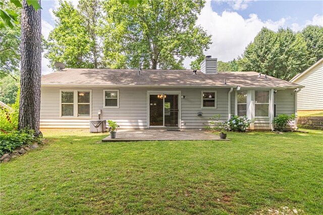 4307 Windward Ln, Norcross, GA 30093 - rear view of property with a patio, a chimney, and a yard