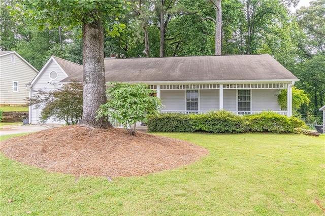 4307 Windward Ln, Norcross, GA 30093 - view of front of property with a front lawn, covered porch, concrete driveway, and view of scattered trees