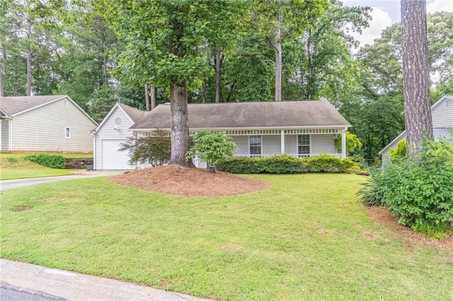 4307 Windward Ln, Norcross, GA 30093 - ranch-style home with driveway, a front lawn, a garage, and view of wooded area