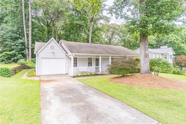 4307 Windward Ln, Norcross, GA 30093 - view of front of home featuring covered porch, a garage, concrete driveway, and a front yard
