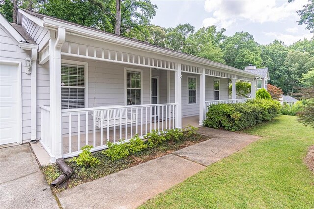 4307 Windward Ln, Norcross, GA 30093 - doorway to property with a porch, a yard, and a chimney