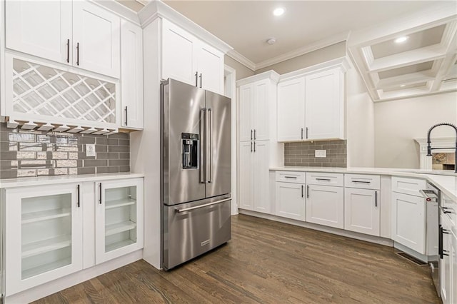 kitchen with high end fridge, sink, white cabinets, and dark hardwood / wood-style floors