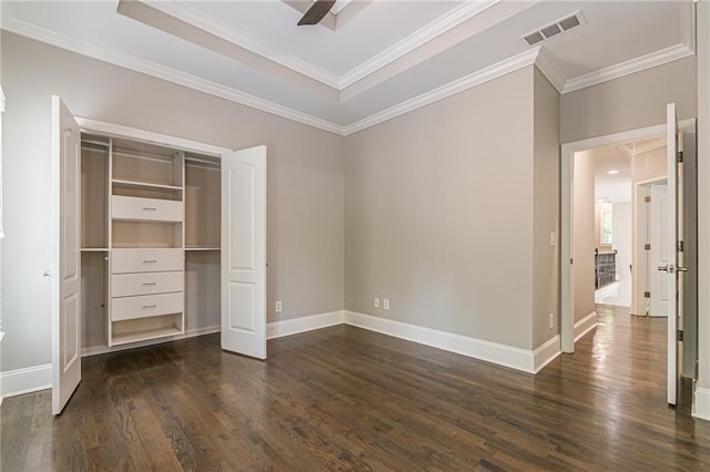 unfurnished bedroom featuring dark hardwood / wood-style flooring, crown molding, a closet, and ceiling fan