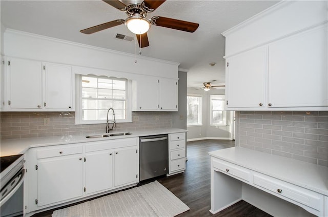 kitchen featuring stainless steel appliances, white cabinets, and sink