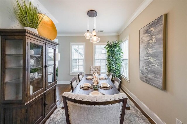 6626 Sterling Dr, Sandy Springs, GA 30328 - dining area featuring baseboards, crown molding, dark wood finished floors, and a chandelier