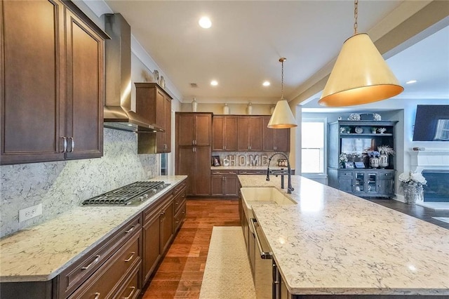 6626 Sterling Dr, Sandy Springs, GA 30328 - kitchen with wall chimney range hood, a sink, stainless steel gas stovetop, a large island, and dark wood finished floors