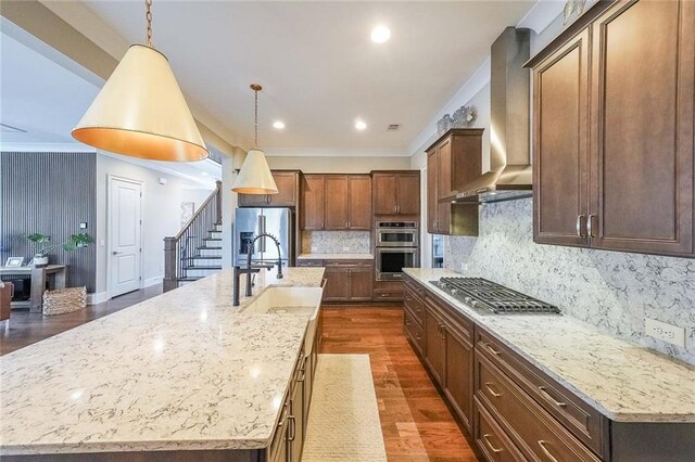 6626 Sterling Dr, Sandy Springs, GA 30328 - kitchen featuring wall chimney range hood, a sink, stainless steel appliances, dark wood-type flooring, and a large island