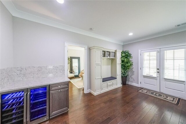 6626 Sterling Dr, Sandy Springs, GA 30328 - indoor dry bar featuring beverage cooler, dark wood-style floors, crown molding, and recessed lighting