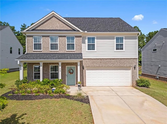 113 Poppy St, Mcdonough, GA 30253 - view of front of house with brick siding, a front yard, driveway, and an attached garage