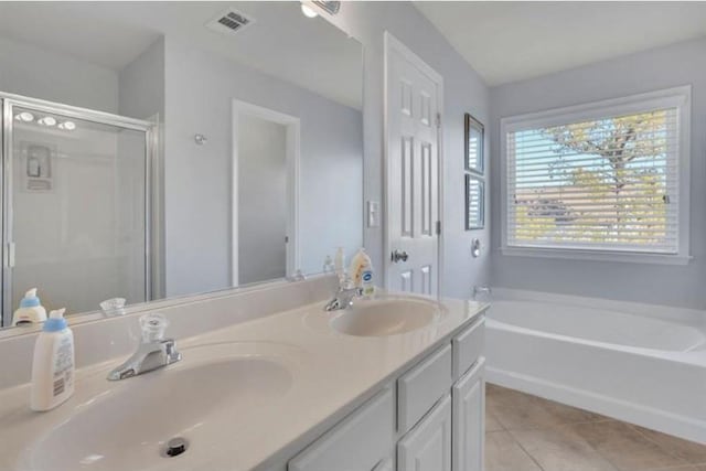 full bathroom featuring tile patterned flooring, visible vents, a shower stall, and a sink