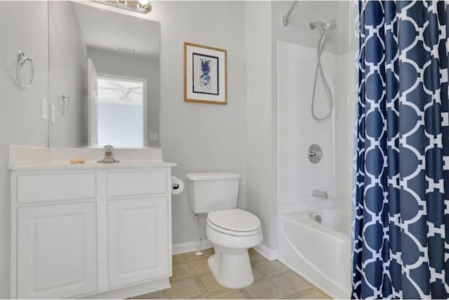 bathroom featuring vanity, visible vents, baseboards, shower / bath combo, and toilet