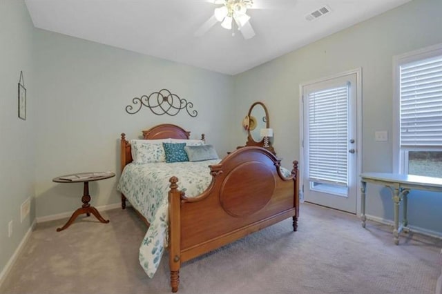 carpeted bedroom with visible vents, baseboards, and ceiling fan