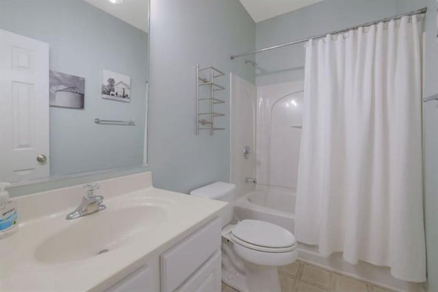 bathroom with shower / bathtub combination with curtain, toilet, and vanity