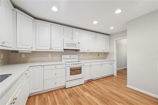 2655 Nesbit Trl, Alpharetta, GA 30022 - kitchen with white appliances, backsplash, light wood finished floors, white cabinetry, and light countertops