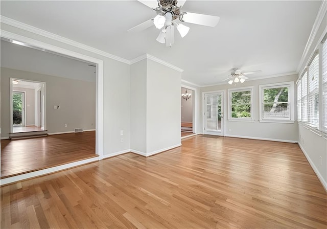 2655 Nesbit Trl, Alpharetta, GA 30022 - unfurnished room featuring light wood finished floors, ornamental molding, ceiling fan, and a chandelier