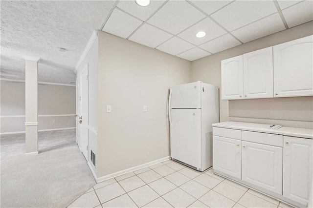 2655 Nesbit Trl, Alpharetta, GA 30022 - kitchen featuring freestanding refrigerator, white cabinetry, light countertops, and recessed lighting