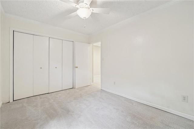 2655 Nesbit Trl, Alpharetta, GA 30022 - unfurnished bedroom with a textured ceiling, ornamental molding, carpet floors, a closet, and a ceiling fan