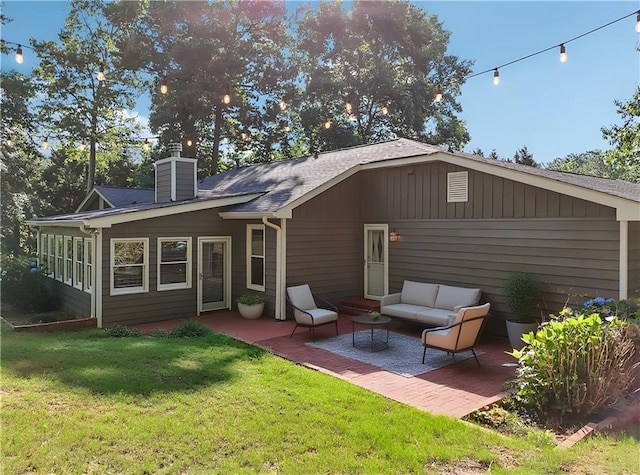 2655 Nesbit Trl, Alpharetta, GA 30022 - back of house with a patio, a yard, a chimney, and an outdoor living space