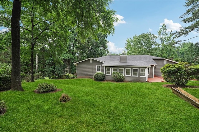 2655 Nesbit Trl, Alpharetta, GA 30022 - rear view of house with a lawn, a patio, and a shingled roof