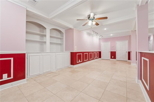 unfurnished room featuring visible vents, built in shelves, crown molding, light tile patterned floors, and a ceiling fan