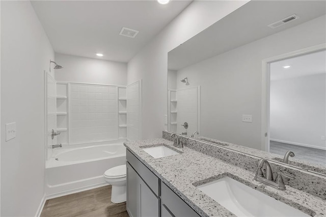 full bathroom featuring a sink, shower / bathing tub combination, toilet, and visible vents