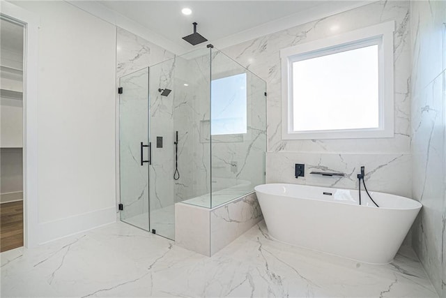 bathroom with a marble finish shower, recessed lighting, marble finish floor, and a freestanding bath