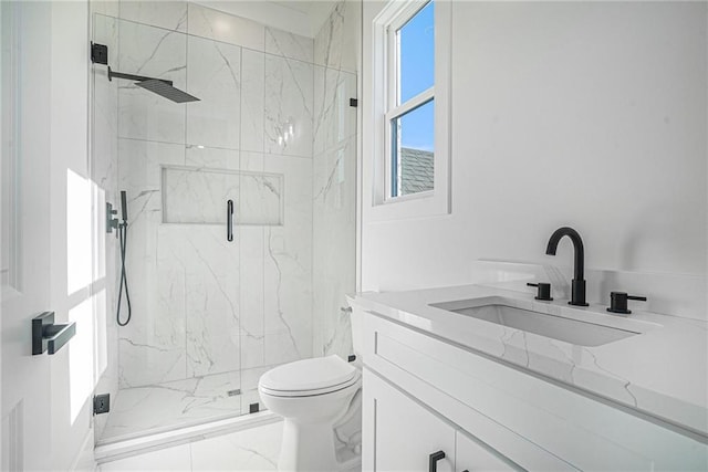 bathroom with a marble finish shower, toilet, vanity, and marble finish floor
