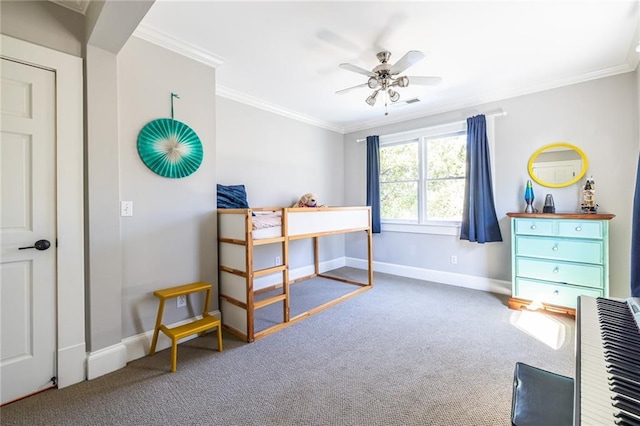 carpeted bedroom featuring ceiling fan, baseboards, and crown molding