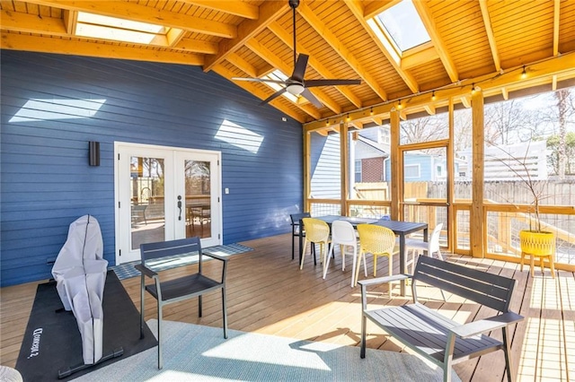 sunroom / solarium with wood ceiling, lofted ceiling with skylight, ceiling fan, and french doors