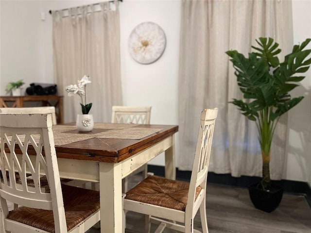 dining room with wood finished floors