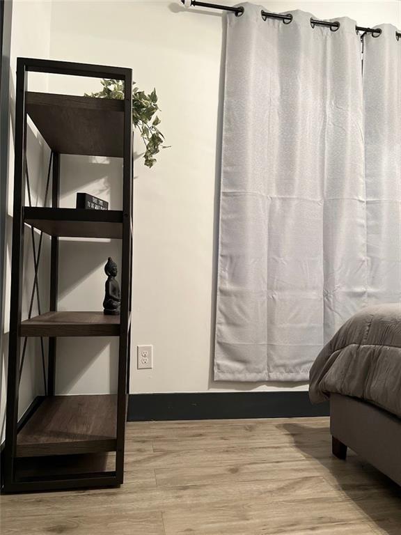 interior space with light wood-style flooring and baseboards