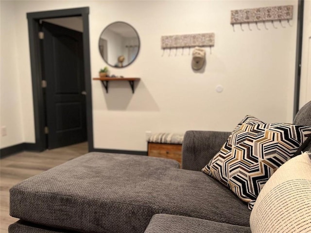 bedroom with light wood-style floors and baseboards