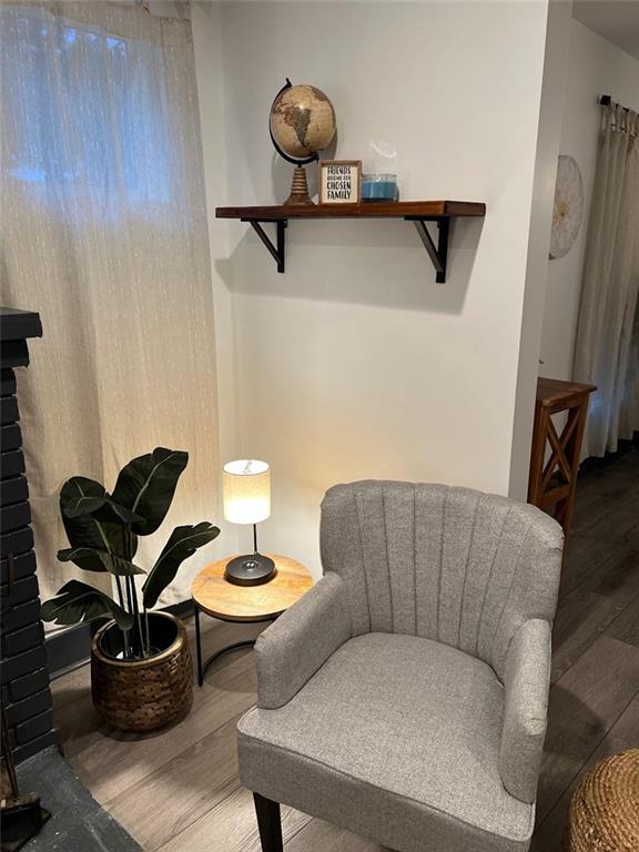 sitting room featuring wood finished floors