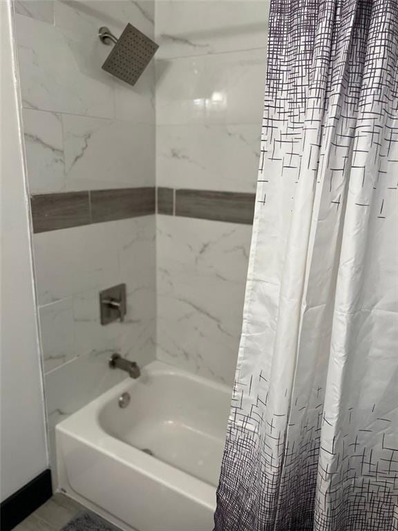 full bath featuring shower / bath combo with shower curtain