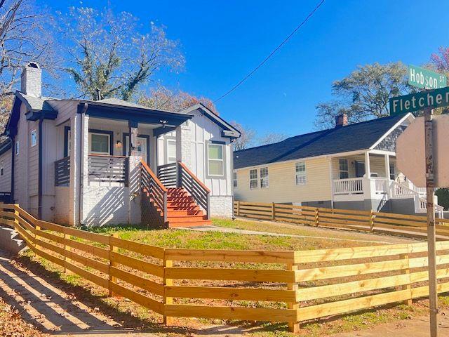 exterior space featuring a fenced front yard and a porch