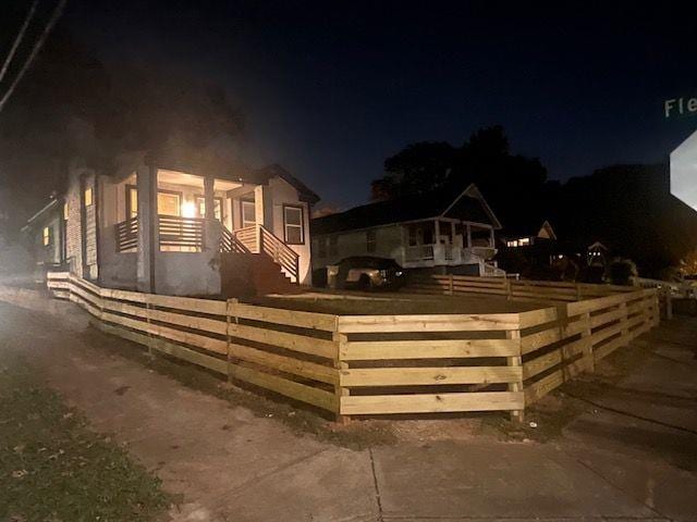 view of front of house featuring fence